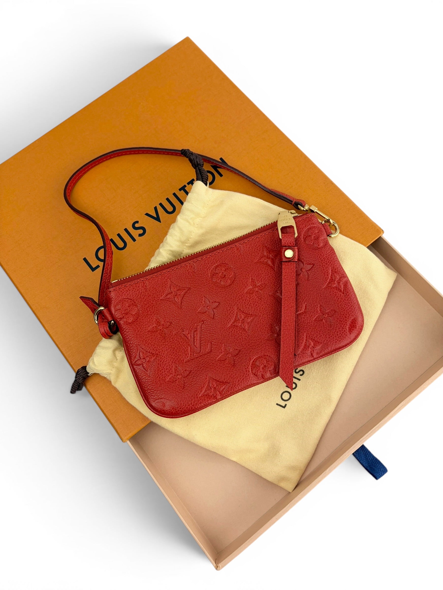 louis-vuitton-red-empreinte-zip-wristlet-1